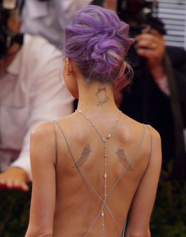 Nicole Richie showing off a sexy back that showed her angel wings, along with two other small tats on the back of her neck