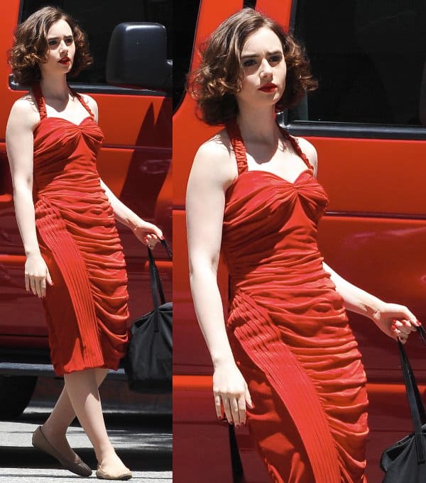 Lily Collins was spotted filming in Los Angeles and looking vampishly gorgeous in a scarlet red dress