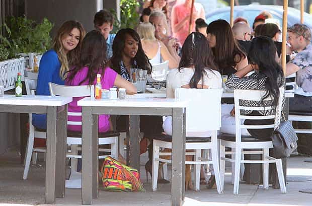 Khloe Kardashian and her sisters filming an episode of Keeping Up with the Kardashians