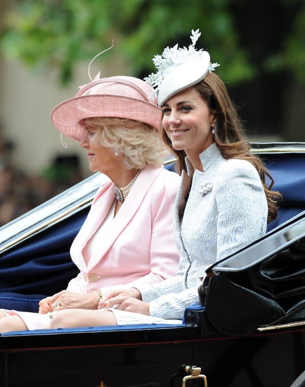 Catherine wearing a hat by Jane Taylor as well as pearl earrings and a brooch by Annoushka
