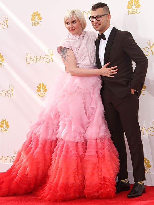 Lena Dunham and boyfriend Jack Antonoff posing together on the 2014 Emmys red carpet