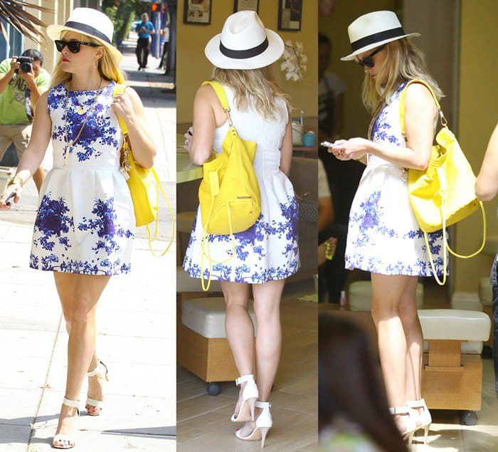 Reese Witherspoon totes Elizabeth and James' bright-yellow 'Cynnie' bag made from croc-effect leather