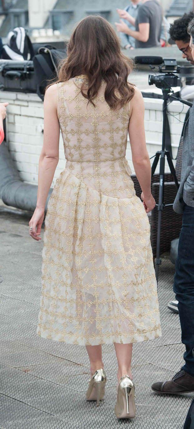 Keira Knightley in a gold and beige dress at the Begin Again photocall