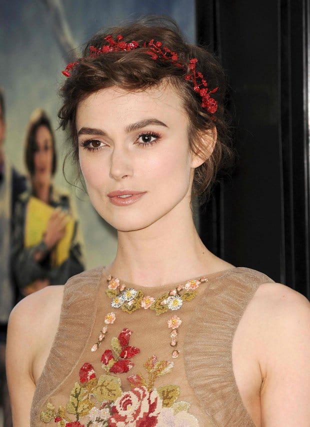 Keira Knightley's slightly messy milkmaid braid and red floral headband