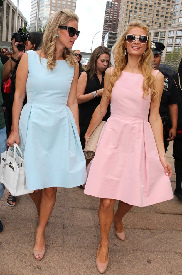 Paris Hilton and Nicky Hilton walking by the Lincoln Center after attending the Dennis Basso fashion show during New York Fashion Week