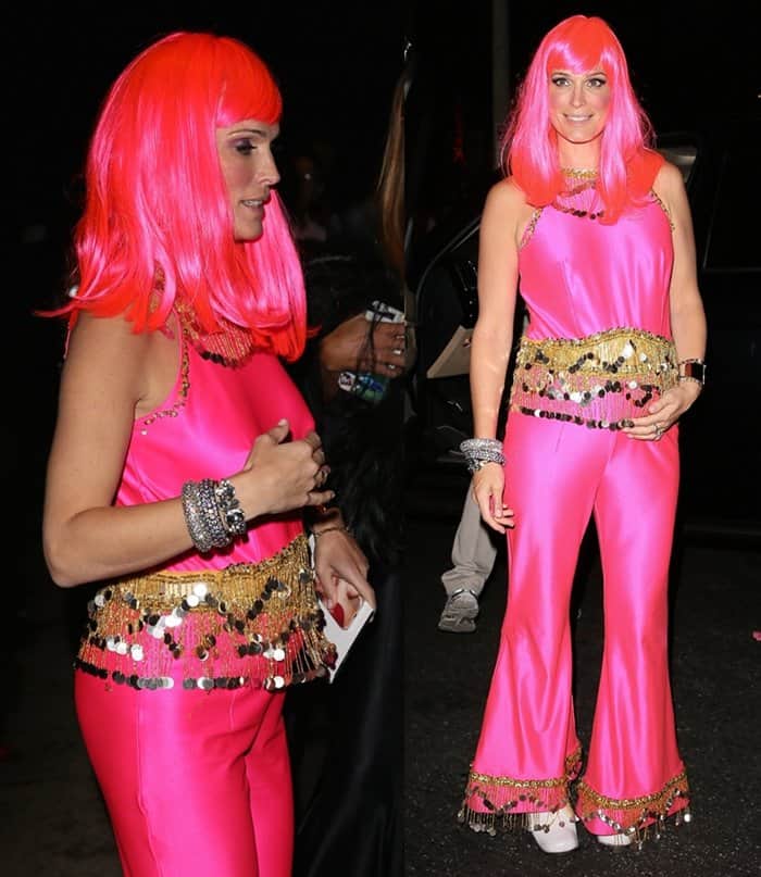 At the Casamigos Tequila Halloween Party in Beverly Hills on October 25, 2014, model Molly Sims flaunted her baby bump in a neon pink jumpsuit and wig