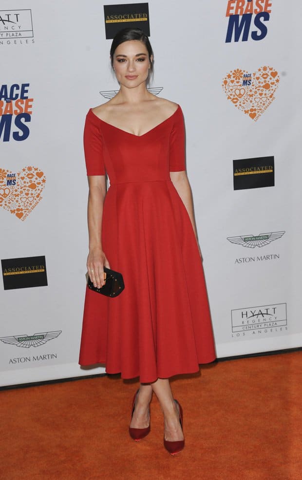 Crystal Reed flaunts her sexy legs in a red tea-length dress