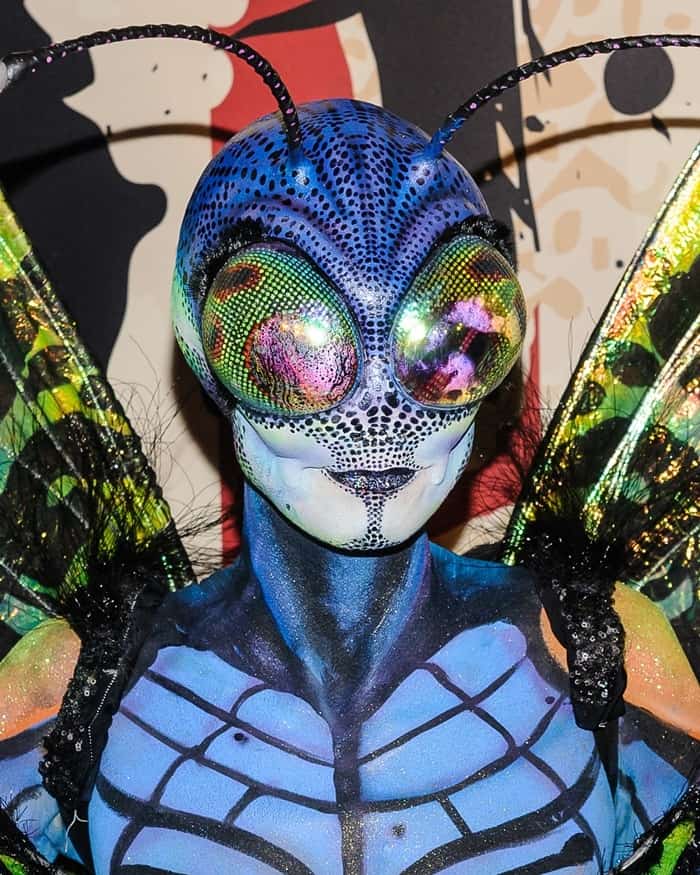 Heidi Klum's butterfly costume was the ultimate one, featuring intricate makeup, body paint, giant and vibrant wings, and prosthetics resembling the reflective compound eyes of the winged creature