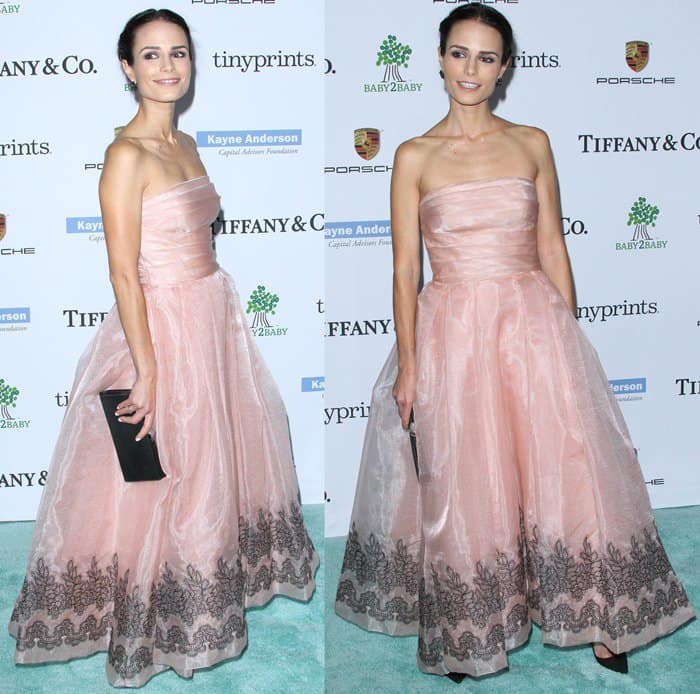 Jordana Brewster in a blush Monique Lhuillier strapless dress from the Fall 2014 collection that had black lace accents near the hemline, balancing out the sweetness of the dress