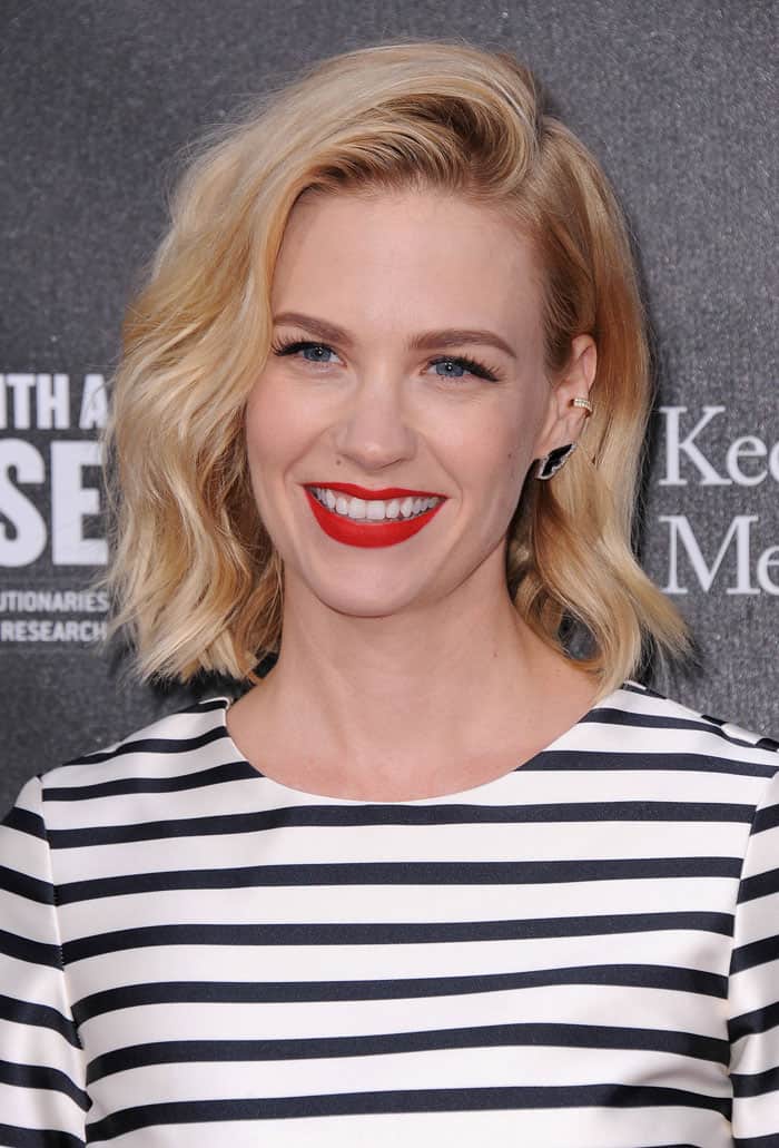 January Jones showed off an on-trend ear cuff and completed her look with tousled waves and a bold red lip