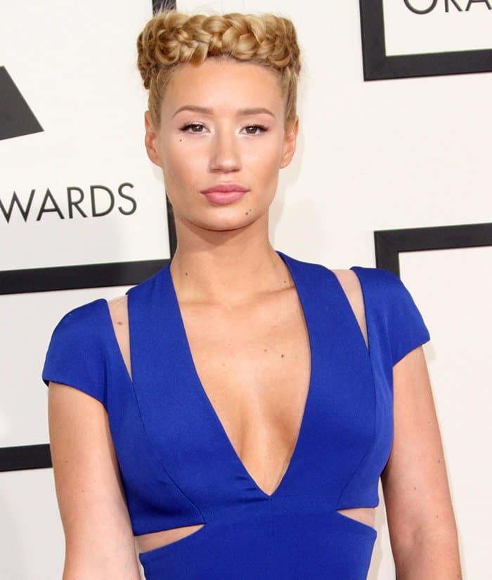 While Iggy Azalea's short-sleeved silk-crepe dress fit her like a glove, her milkmaid-inspired crown braid didn't quite match the sophisticated outfit, detracting from the stunning gown
