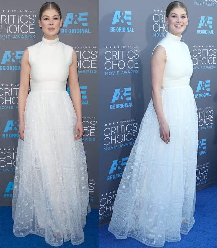 Rosamund Pike wearing a white Valentino Couture dress, Jimmy Choo sandals, and Fred Leighton jewelry