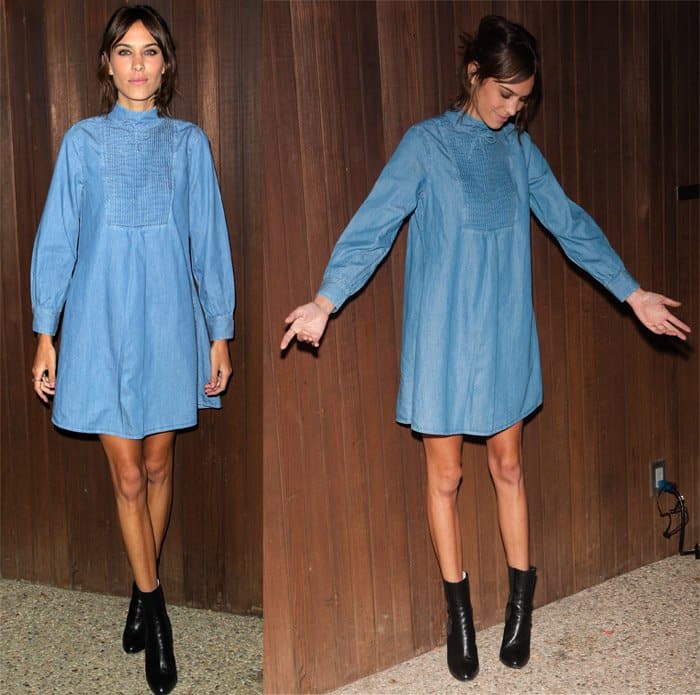 Alexa Chung flaunts her legs in a denim mini dress featuring a chic smock silhouette and pintucked front at the Alexa Chung x AG Collection