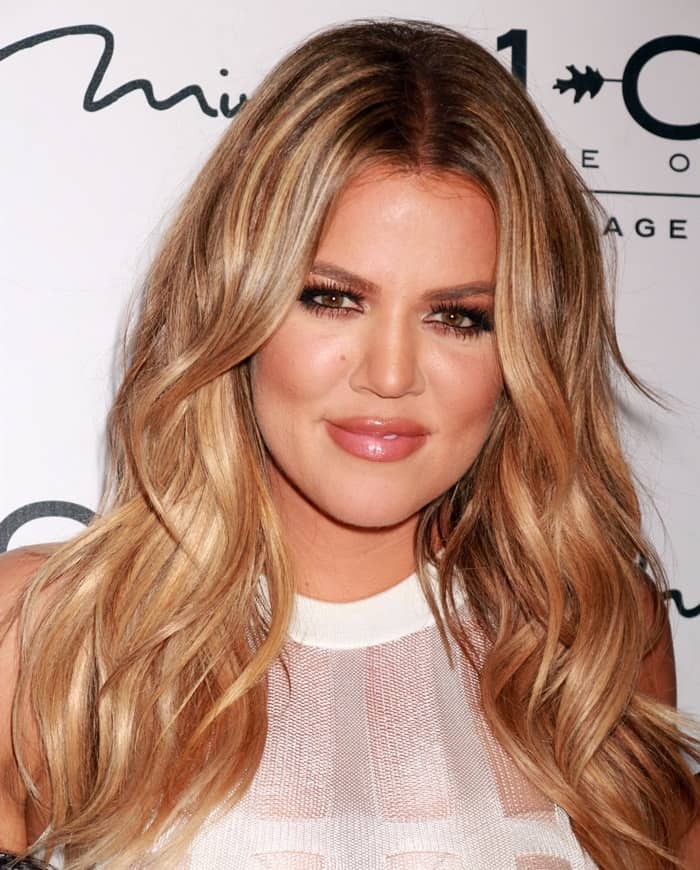 Khloe Kardashian in a dress featuring sheer panels and made of pearlescent wool at a 1Oak Nightclub event