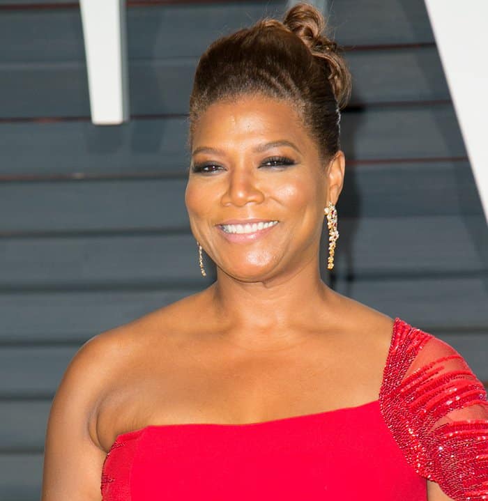 Queen Latifah's gown featured an embroidered cap sleeve and was styled with Carrera y Carrera gold flower earrings featuring rubies and diamonds at the 2015 Vanity Fair Oscar Party