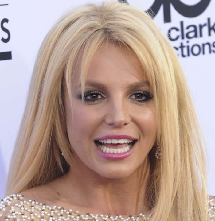 Britney Spears' styling of her blonde hair and pink lip was described as dated