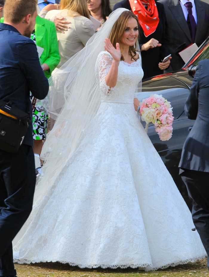 Geri Halliwell's wedding gown was crafted entirely at the Phillipa Lepley atelier in Chelsea and showcased a full silk duchess satin skirt with a delicate French corded lace overlay, complete with long sleeves and a stunning silk tulle veil