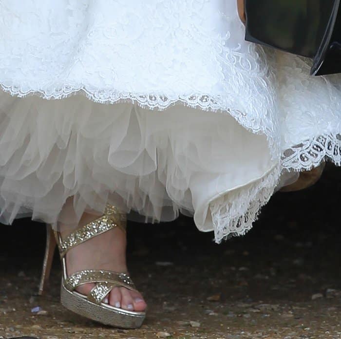 Geri Halliwell paired her bridal gown with gold metallic ankle-strap platform heels