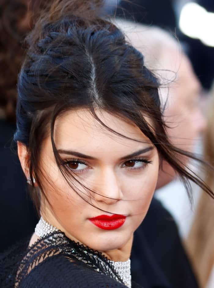 Kendall Jenner's laidback updo kept the look feeling fresh and fun, while her bright red lip provided a perfect pop of color that complemented the red carpet