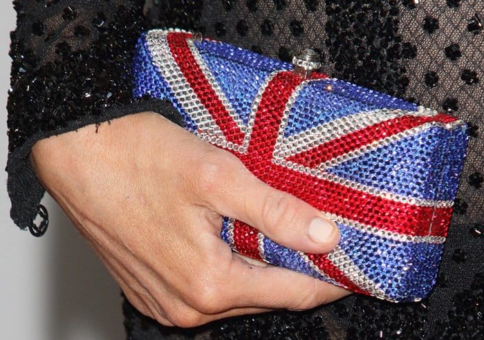 Paris Hilton toted a small Marc Defang Union Jack clutch purse adorned with jewels