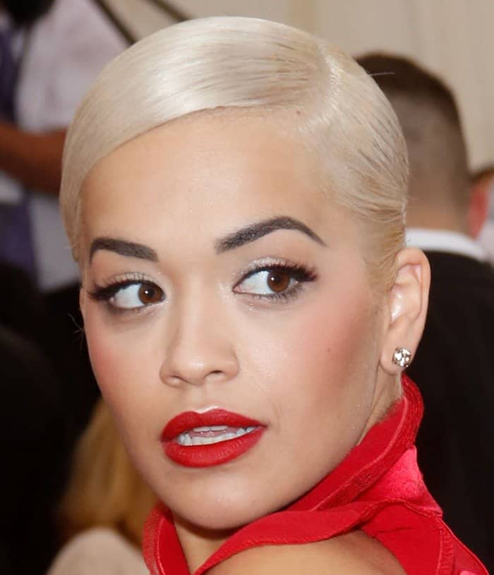 Rita Ora donned a red Tom Ford dress that she paired with Lorraine Schwartz jewelry