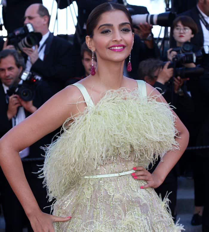 Indian actress Sonam Kapoor stunned at her fifth consecutive year attending the Cannes Film Festival in a light yellow feathered Elie Saab couture dress, turning heads on the red carpet at the 'Inside Out' premiere