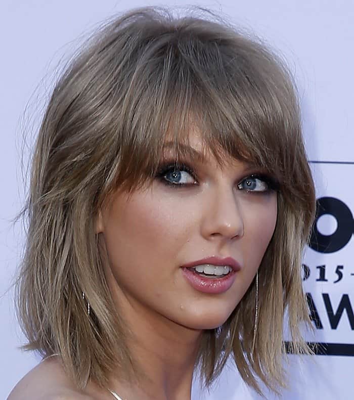 Taylor Swift completed the look with a smoky eye and messy bob