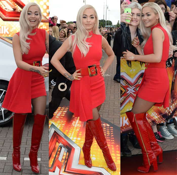 Rita Ora in a striking flame-red mini dress from Versace's Fall 2015 collection paired with custom-made Giuseppe Zanotti over-the-knee boots featuring croc-embossed leather in a matching shade of red
