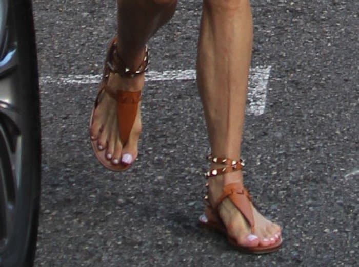 Kristin Chenoweth shows off her feet in brown sandals