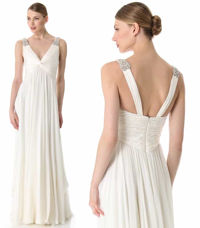 Romantic without feeling overdone, this ivory silk gown has jeweled straps and a twist detail at the pleated bodice