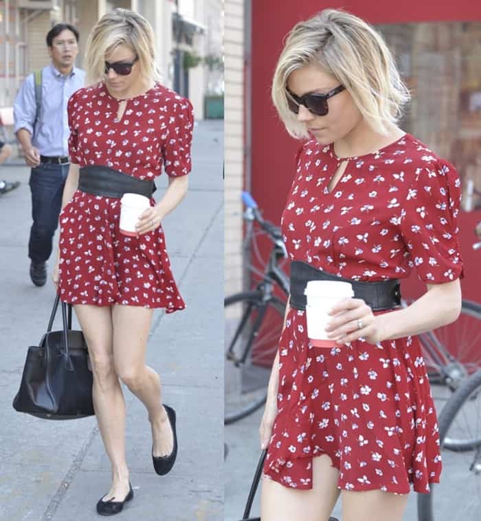Sienna Miller spotted wearing a red floral frock while out and about in SoHo.