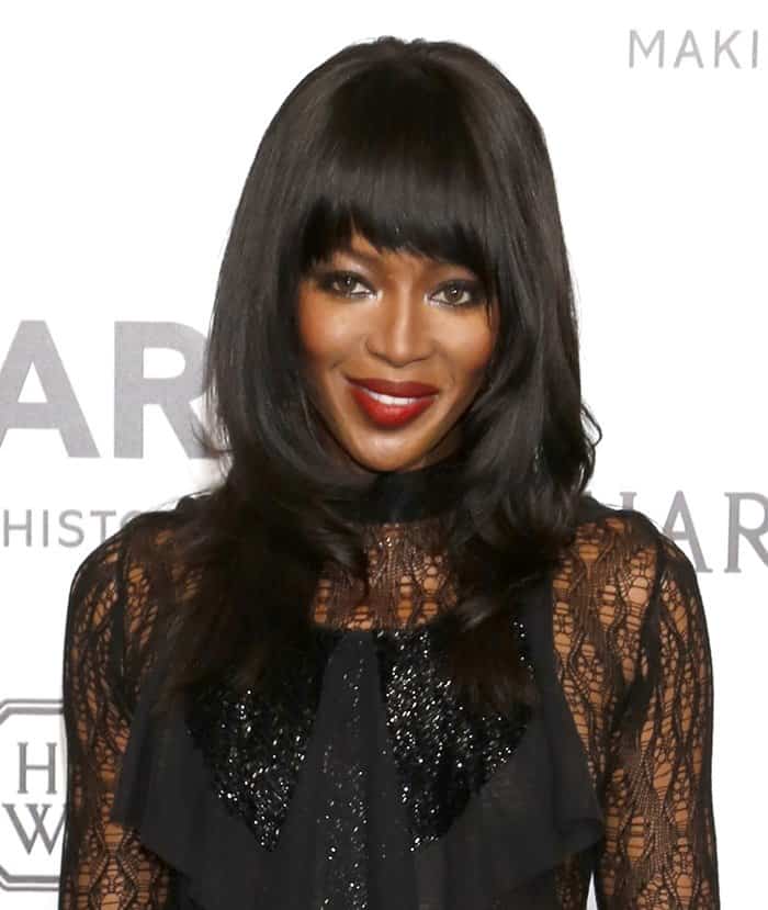 Naomi Campbell embraced a gothic vibe, donning a black spiderweb-lace gown from Maison Margiela's Fall 2015 collection