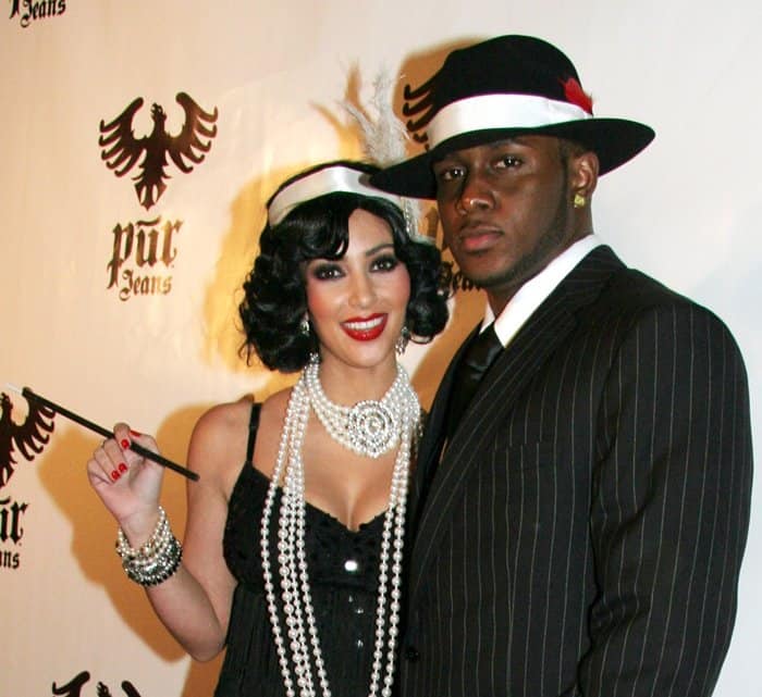 Kim Kardashian and Reggie Bush dressed as a Flapper and a Mobster