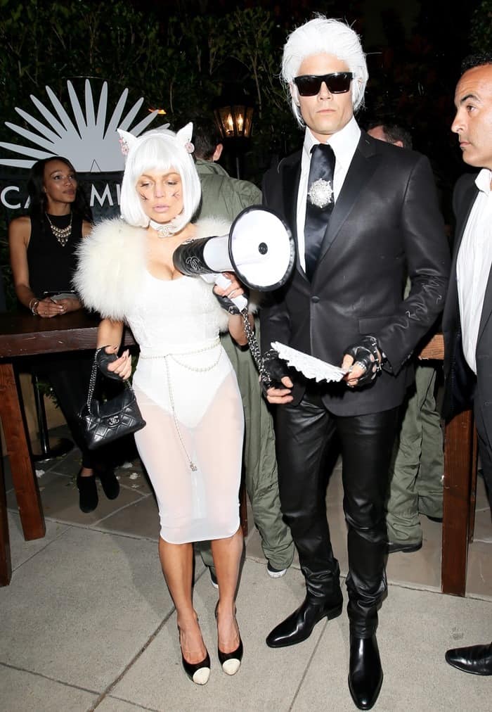 Josh Duhamel and Fergie truly made a statement for Halloween, showcasing their impeccable sense of style by dressing up as Chanel designer Karl Lagerfeld and his beloved cat, Choupette