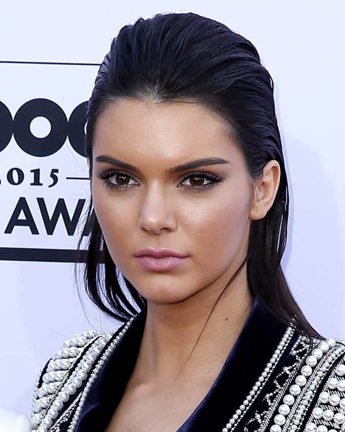 Kendall Jenner complemented her outfit with a sophisticated, slicked-back hairstyle at the 2015 Billboard Music Awards