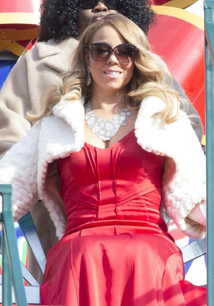 Riding her float like a queen, Mariah Carey smiles at attendees of the Macy's Thanksgiving Day Parade in New York on November 26, 2015