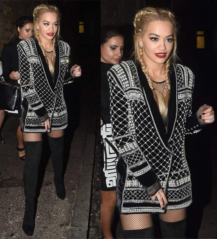Rita Ora's ensemble featured the eye-catching blazer, complemented by black thigh-high boots and fishnet stockings