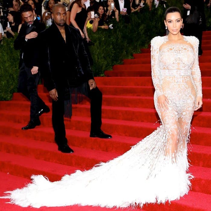 Kim Kardashian in a backless Roberto Cavalli white gown designed by Peter Dundas at the 'China: Through The Looking Glass' Costume Institute Benefit Gala