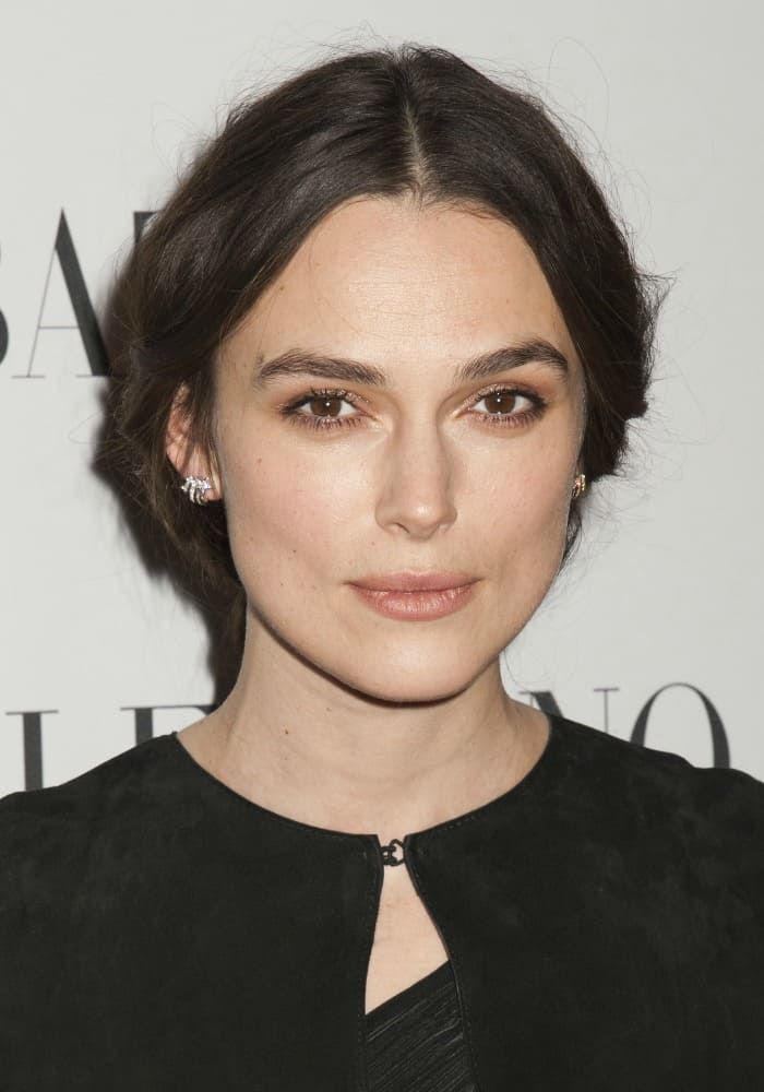 Keira Knightley's striking facial features were accentuated by flawlessly applied tones of muted makeup, while her brunette locks were swept up into an elegant bun