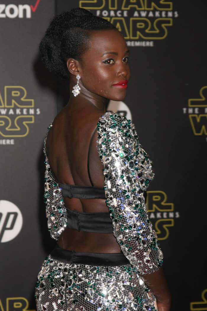 Lupita Nyong’o's dress would look better on someone with a longer torso and the black bands around the waist are unforgiving