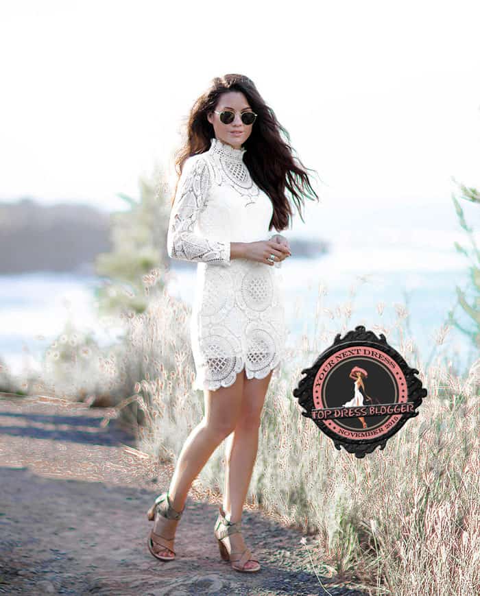 Sarah Christine pairs her white lace dress with snakeskin sandals