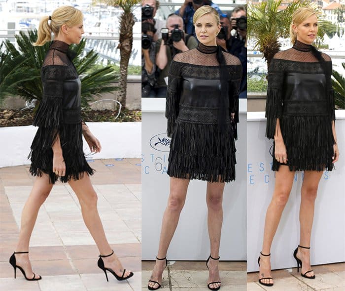 Charlize Theron in a Valentino Fall 2015 black dress that had plenty of flair due to its fringe detailing and point d’esprit yoke at the "Mad Max : Fury Road" Photocall during the 68th annual Cannes Film Festival