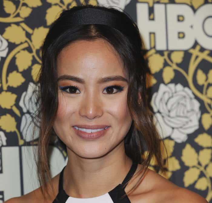 Jamie Chung accessorizing with a headband and choosing striking blue winged eyeliner at HBO's post-2016 Golden Globe Awards party