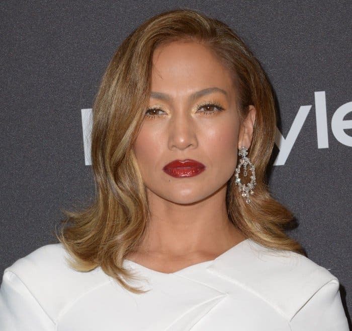 Jennifer Lopez's rouge noir lips were a great contrast to the innocent white of the dress at the 2016 InStyle And Warner Bros. 73rd Annual Golden Globe Awards Post-Party