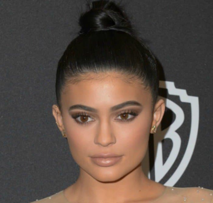 Kylie Jenner pulled her hair back into a sleek bun and donned heavy, contoured makeup with smoky eyes