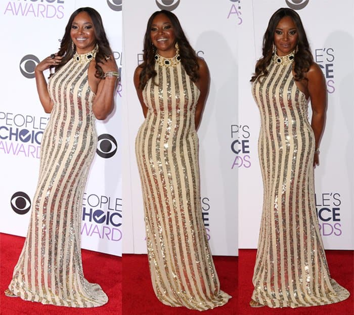 In a striped embellished dress featuring a jewel-encrusted neckline, Tamala Jones confidently flaunted her curves