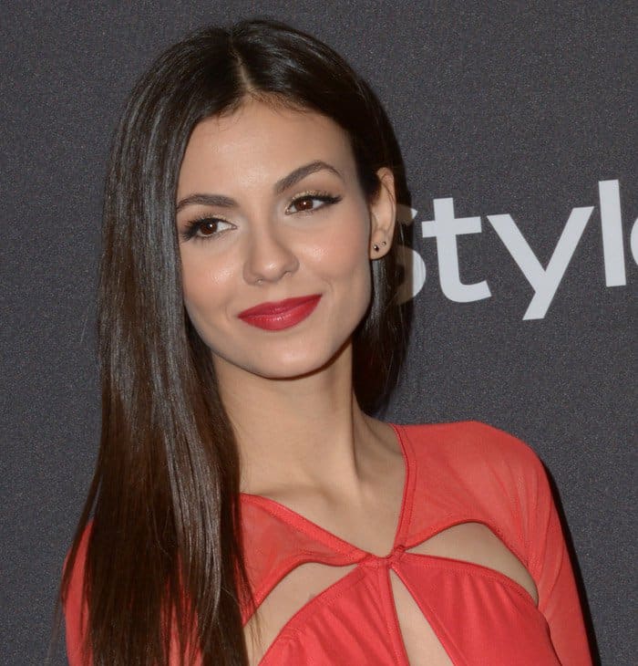 Victoria Justice exuding modern glamour in a flowing red cutout gown designed by Bao Tranchi at the 2016 InStyle And Warner Bros. 73rd Annual Golden Globe Awards Post-Party
