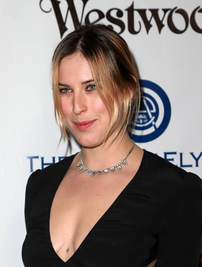 Scout LaRue Willis' black dress had long sleeves, a plunging neckline, and wide side cutouts that accentuated her slim frame