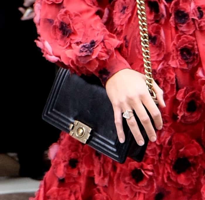 Blake Lively accessorized with a black Chanel chain strap shoulder bag