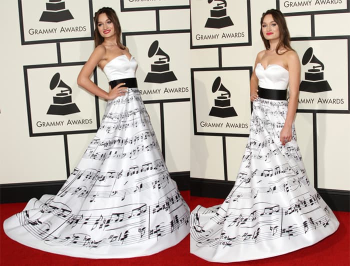 Diana Gloster in an off-shoulder white gown with music notes printed all over it at the 58th Annual Grammy Awards